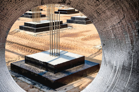 Monolithic reinforced concrete foundations for the construction of a residential building. Grillage at the construction site. Construction pit with foundationsの写真素材