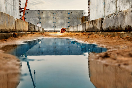 Monolithic reinforced concrete work at the construction site. Boards for the construction of formwork. Erection and reinforcement of reinforced concrete walls of the buildingの写真素材
