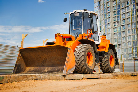 Heavy front loader or bulldozer at the construction site. construction equipment. Transportation and movement of bulk materials. Rental of construction equipmentの写真素材