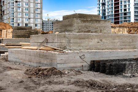 Monolithic reinforced concrete foundations for the construction of a large building. Rostverk at the construction site. Construction pit with foundation. close-upの写真素材