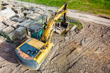 A powerful crawler excavator is working on a construction site. close-up. view from above....