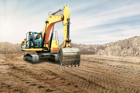 Crawler excavator works in a sand pit against the sky. Powerful earthmoving equipment. excavation....