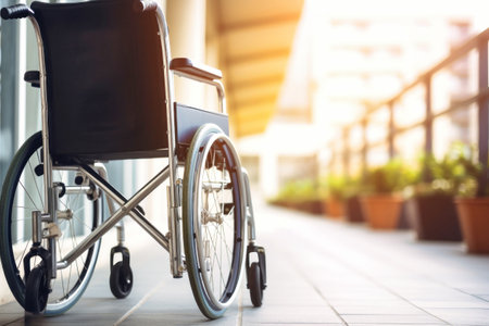 A wheelchair sits outside of a building. Concept for supporting people with disabilities.の素材