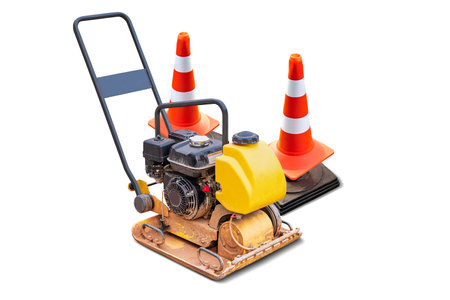 A small road compaction plate, used for soil compaction in construction projects. efficient for smaller areas that require flattening and smoothing. Isolatedの写真素材
