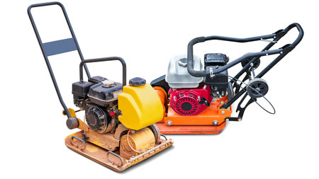 two road compacting machines used for soil compaction, placed on a white background. designed to flatten and compact surfaces for construction projects. Isolatedの写真素材