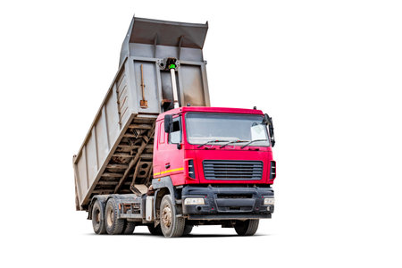 Large dump truck car with a raised body on a white isolated white background. Car for transportation of heavy bulk cargo. Construction equipment. Element for designの写真素材