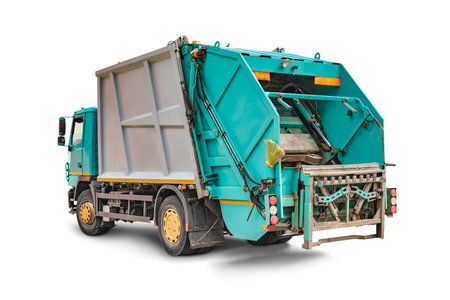 Garbage truck on a white isolated background. Separate collection and disposal of garbage. Vehicle for gathering and disposal of garbageの写真素材