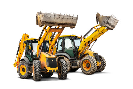Two heavy front loaders or bulldozers on a white isolated background. Construction equipment and transport. Transportation and movement of bulk materials. Excavation. Element for designの写真素材