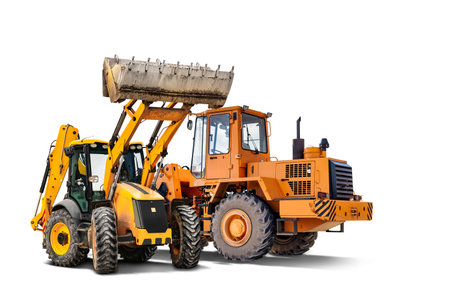 Two heavy front loaders or bulldozers on a white isolated background. Construction equipment and transport. Transportation and movement of bulk materials. Excavation. Element for designの写真素材