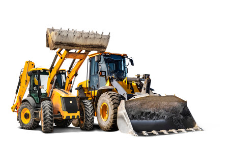 Two heavy front loaders or bulldozers on a white isolated background. Construction equipment and transport. Transportation and movement of bulk materials. Excavation. Element for designの写真素材