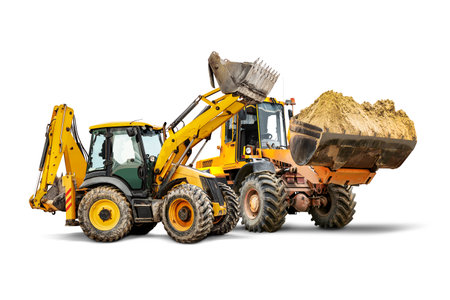 Two heavy front loaders or bulldozers on a white isolated background. Construction equipment and transport. Transportation and movement of bulk materials. Excavation. Element for designの写真素材