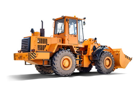 Heavy front loader or bulldozer on a white isolated background. construction machinery. Transportation and movement of bulk materials. Large bucket for earth, sand and gravelの写真素材