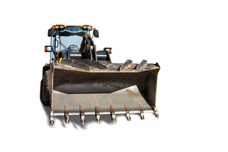 Heavy front loader or bulldozer on a white isolated background. construction machinery. Transportation and movement of bulk materials. Large bucket for earth, sand and gravel. Front viewの写真素材