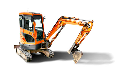 Mini excavator on a white isolated background. Compact construction equipment for earthworks. close-up Element for design. Rental of construction equipmentの写真素材