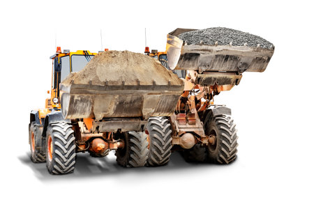 Two heavy front loaders or bulldozers on a white isolated background. Sand and gravel in a large bucket. Construction equipment. Transportation and movement of bulk materialsの写真素材