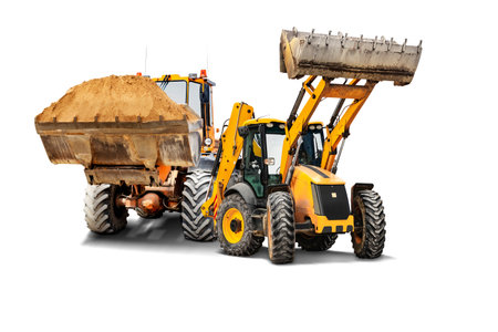 Two heavy front loaders or bulldozers on a white isolated background. Construction equipment and transport. Transportation and movement of bulk materials. Excavation. Element for designの写真素材