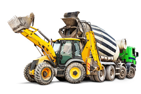 Concrete mixer truck and bulldozer loader close-up on a white isolated background.Construction equipment. element for design. Rental of construction equipment. delivery of concreteの写真素材