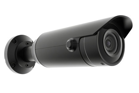 A black outdoor street video surveillance camera mounted on a white background. Isolatedの素材
