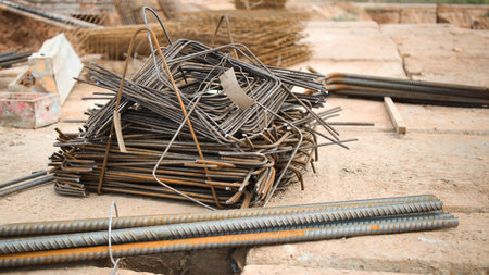 Embedded parts for the foundation at the construction site. Close-up. Elements for pouring a reinforced concrete foundation or grillage. Modern concrete workの写真素材
