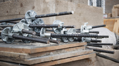Timber formwork with metal reinforcement for pouring concrete and creating a solid foundation for a building. construction process. Rods for screed formwork close-upの写真素材