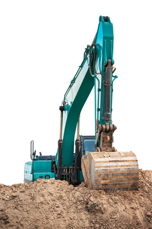 A massive excavator maneuvers its robust arm, digging deep into a mound of earth. The machine glints in the warm sunlight, highlighting its strength and precision.の写真素材