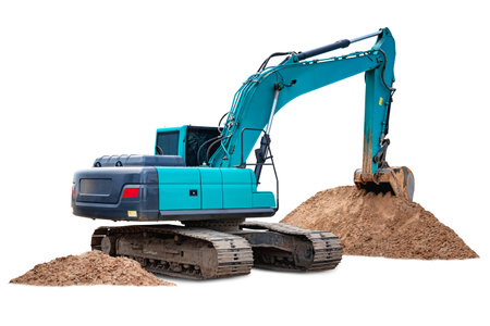 The bright blue excavator operates on a dry site, digging and shifting large piles of dirt, showing the power of heavy machinery in action.の写真素材
