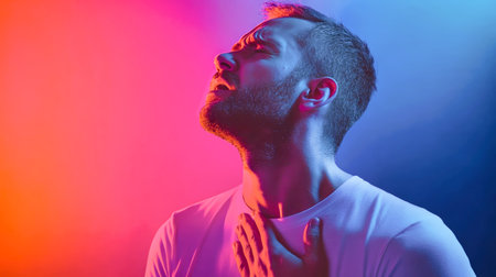 A man expresses intense discomfort, gripping his chest as vivid colors swirl around him, evoking a strong sense of urgency and emotional struggle.の素材