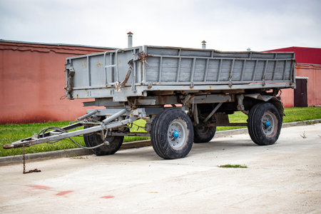 A mammoth trailer sits idly at the roadside, dwarfing everything around it with its sheer size and power.の写真素材