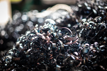 Metal filings from a turning production process are gathered and stored for recycling in an...