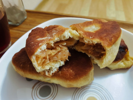 Fluffy bread filled with a mix of vegetables is served warm, inviting family and friends to savor a delicious snack together during a relaxing afternoon.の写真素材