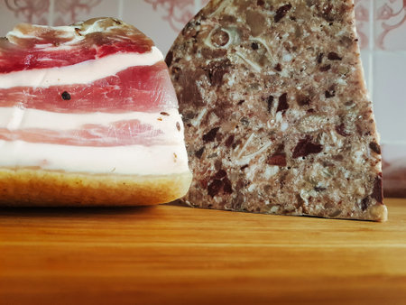 An exquisite display of cured meats highlighting the layers of flavor and artisanal techniques. The rustic wooden board adds to the charm of this culinary delight.の写真素材