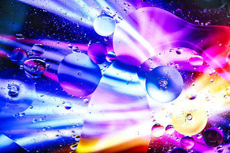 Colorful droplets and swirling shapes come together under a microscope, revealing a stunning...