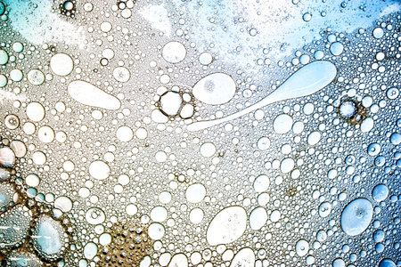 Exploring the fascinating realm of microstructures, this visual features abstract arrangements of bubbles in varying sizes, showing exquisite patterns and colors.の写真素材