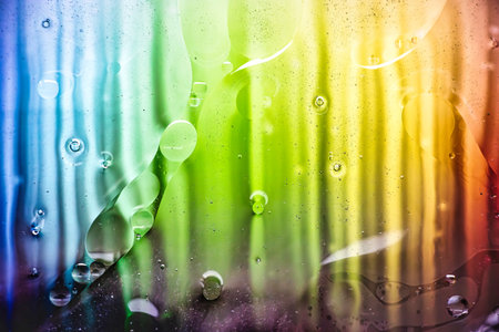 Under the lens of a microscope, vibrant colors and fluid shapes intertwine, transforming everyday materials into captivating abstract art.の写真素材