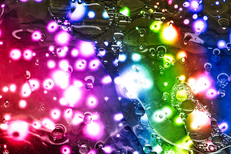 A vibrant display of colorful abstract patterns unfolds under a microscope, showcasing artistic forms at a micro art exhibition.の写真素材