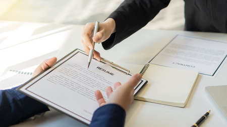 Interviewers are reading resume, job applicants' documents.の写真素材