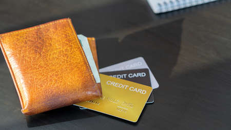 Wallet and credit card for black table spendingの写真素材