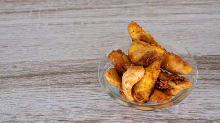 Fried bananas in glass bowls on the dining tableの写真素材