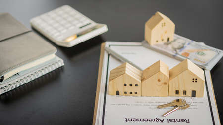 Real estate agents and borrowing, debt contracts and housing investments. Loan Agreement for Investors or Buyers to sign for bank approval, idea of âârenting a home and selling a home.の写真素材
