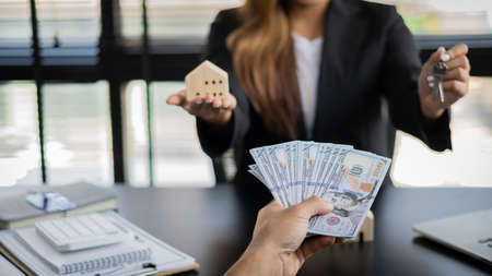 Real estate agents and borrowing, debt contracts and housing investments. Loan Agreement for Investors or Buyers to sign for bank approval, idea of âârenting a home and selling a home.の写真素材