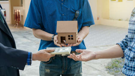 The home sales representative is delivering the tiny home design and paying the home seller after...