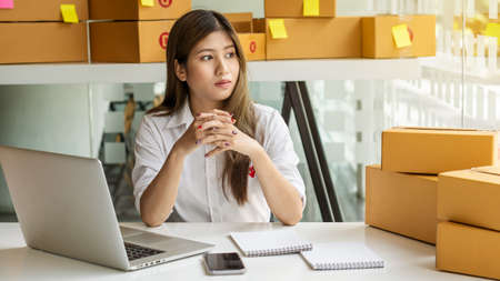 Small Business Startup Freelance SME Entrepreneur Asian Young Women Work At Home Smart Phone Boxes...