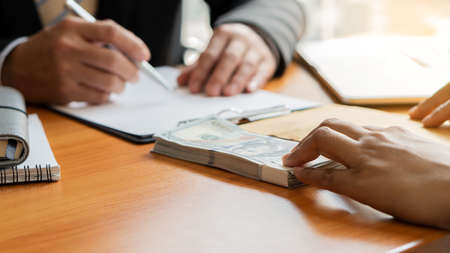 Businessmen were offered money negotiating a deal in which the dollar was bribed in corruption. The...