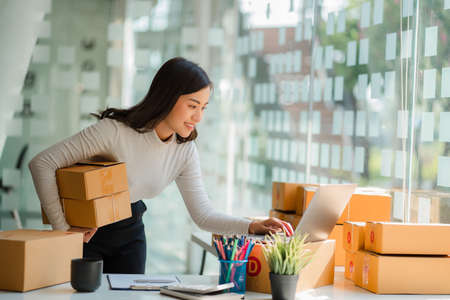 Start a small business, independent SME entrepreneur, portrait of Asian woman working from home,...