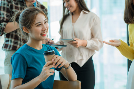 a group of successful business people in the conference room Asia Youth Team Startup Ideas: Meet young entrepreneurs brainstorm business plans and share ideas in a workshop.の写真素材