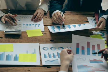 Business team meetings, presenting new ideas and making reports to professional financial investors...