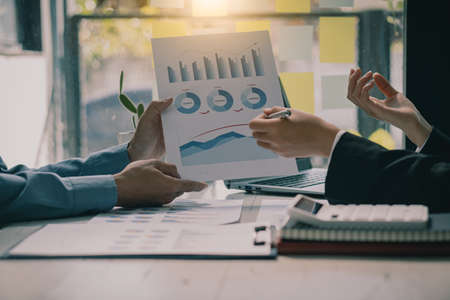 team work process Businessman working in the office discussing paperwork and working on financial reports. Talk about an investment business plan. financial analysis conceptの写真素材