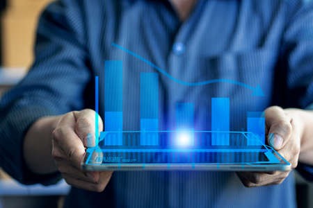 businessman using tablet Analytical concepts and finance and banking technology. and new business...
