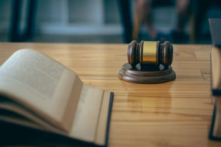 Judge's hammer and law books on lawyer's tableの写真素材