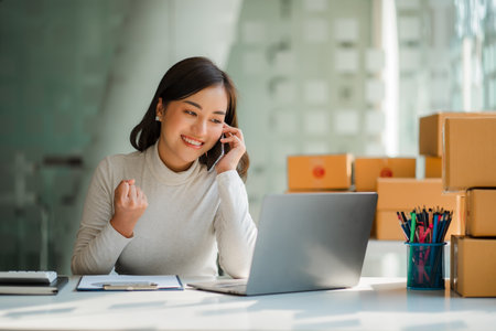 Small business startups, SME owners, Asian women entrepreneurs Successfully working with boxes and...